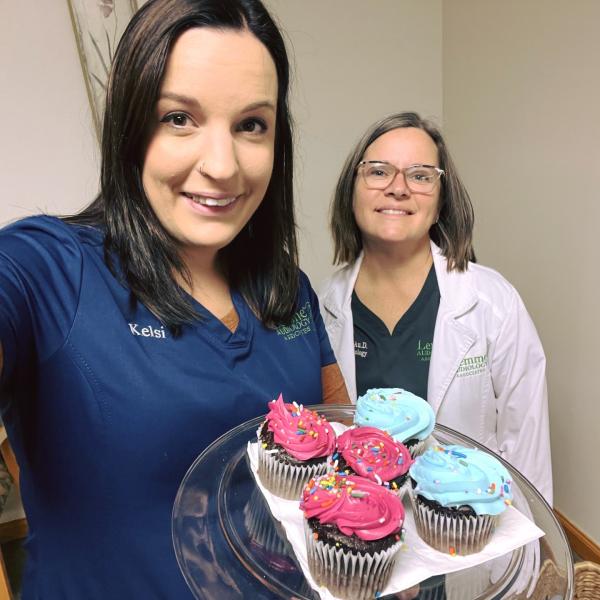 Kelsi and Dr. Greer getting ready to celebrate Cupcake Day with the patients